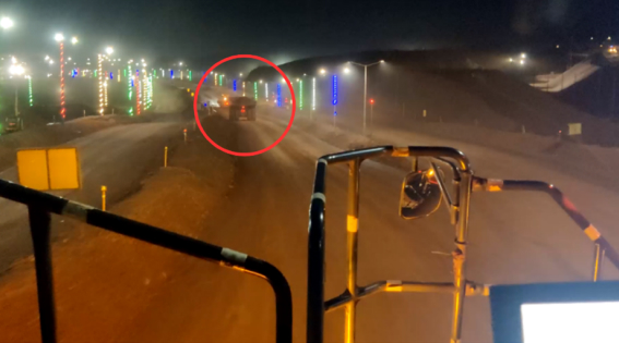 Visual as seen with the naked eye, where only one truck is visible